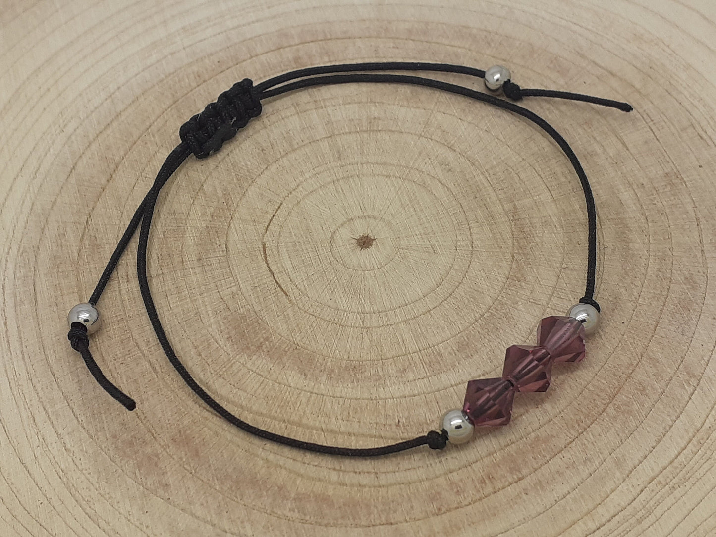 Amethyst Bracelet on a wood background