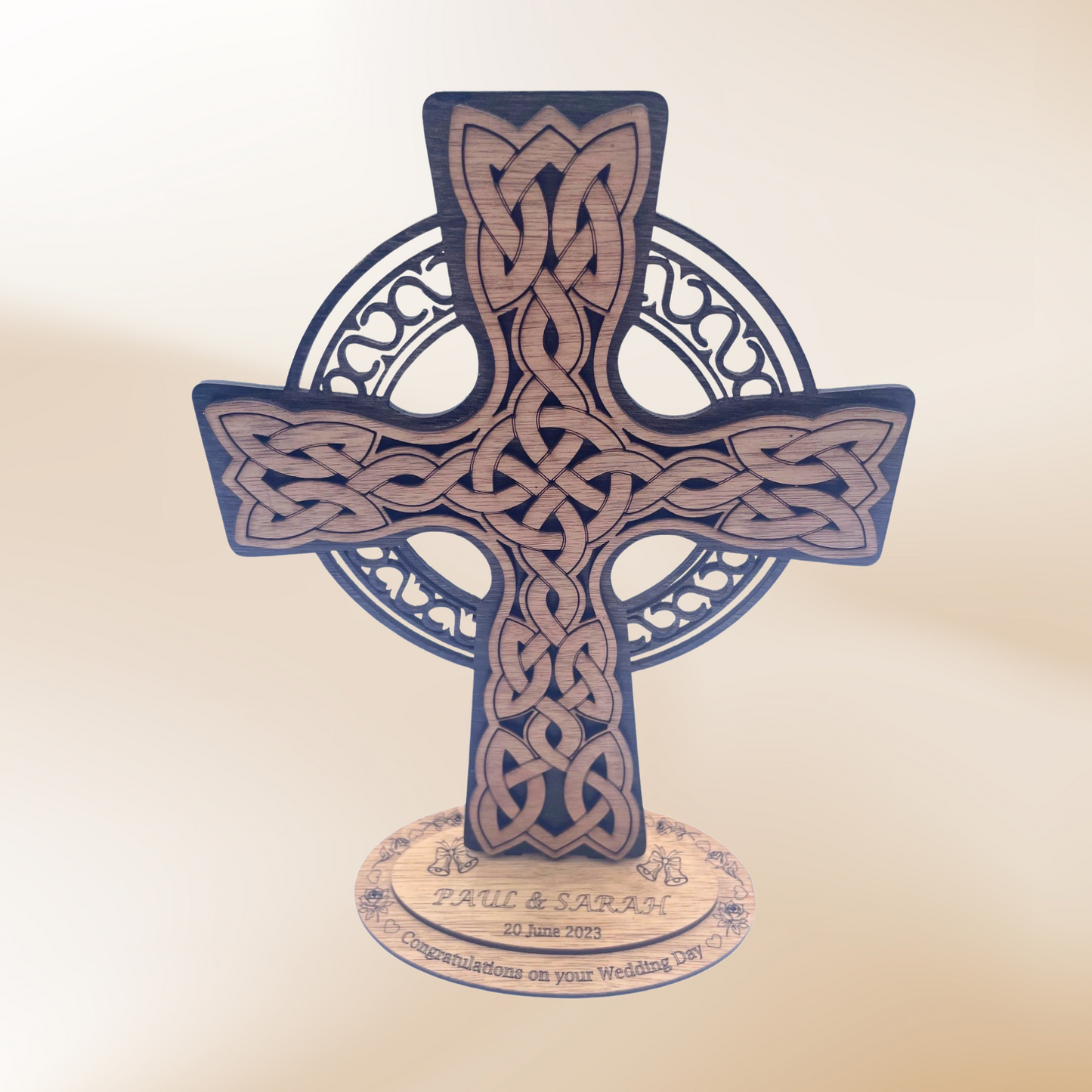 Black and Brown Celtic Cross sitting on a personalised wedding day base