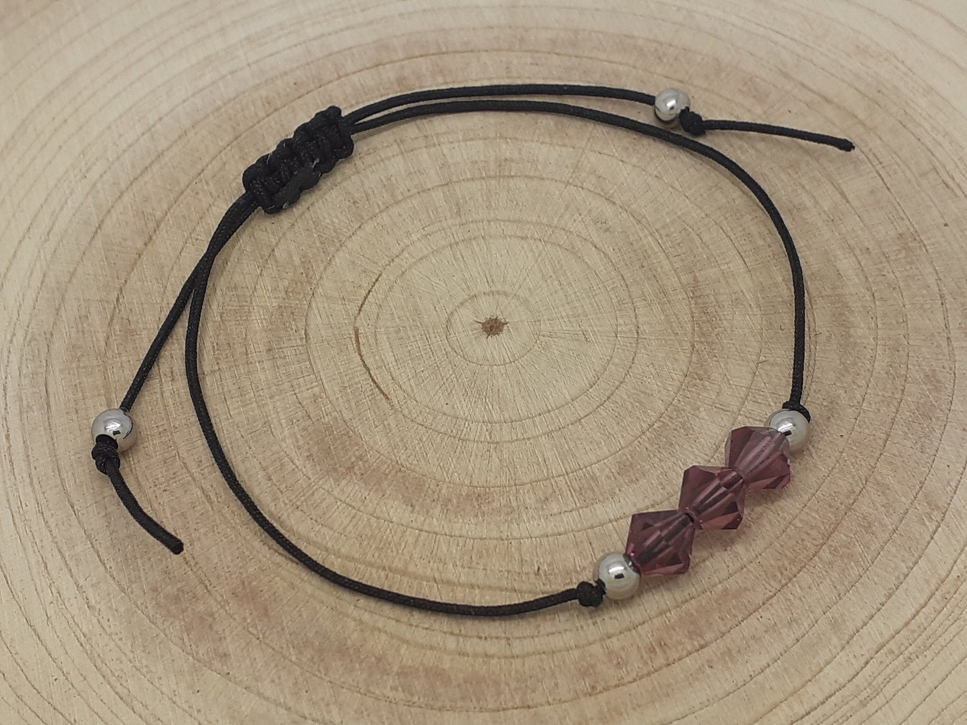 Amethyst Bracelet on a wood background