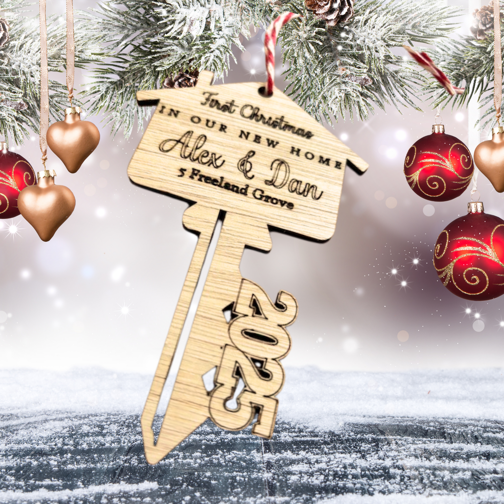 Wooden laser cut key with engraved wording of First Christmas in our New Home with personalised names and address for 2025